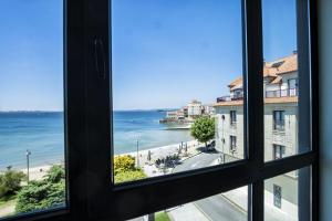 a view of the ocean from a window at Alda Carril in Vilagarcia de Arousa