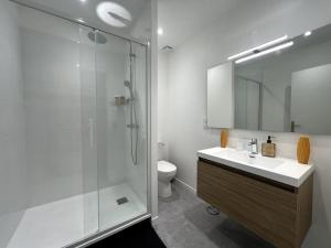 a bathroom with a shower and a sink and a toilet at Family house - Exterieur 4 pers - 3 beds in Fontainebleau