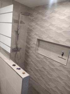 a bathroom with a shower and a sink at La Catumbela in Tuineje