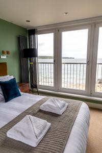 Postel nebo postele na pokoji v ubytování Marine Rooms + 37 fotografií