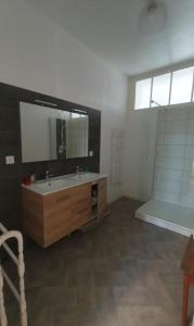 a bathroom with a sink and a mirror at Big Townhouse In Paray Le Monial For 25 People in Paray-le-Monial +17 photos
