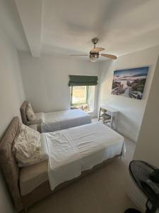 Postel nebo postele na pokoji v ubytování Happy Holiday House Hava