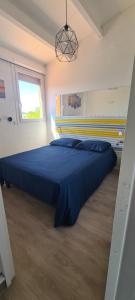 Letto o letti in una camera di Villa ou chambres sur l'Île des Marinas au Cap d'Agde
