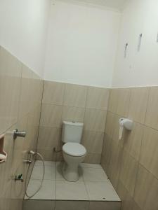 a bathroom with a toilet in a stall at Noor Homestay Tetebatu in Tetebatu
