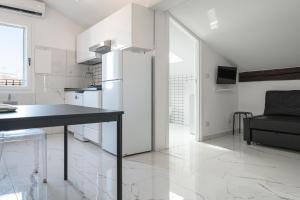 Kuchyňa alebo kuchynka v ubytovaní Saragozza Apartments