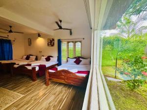 Postel nebo postele na pokoji v ubytování Coorg Nest Cottages By Dreamy Vacations