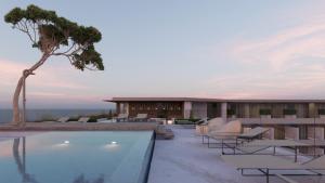 a hotel with a swimming pool and a resort at The Editory Ocean Way Funchal in Funchal