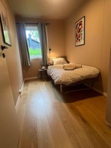 Postel nebo postele na pokoji v ubytování Hus i Harstad