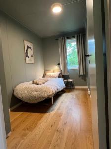 Postel nebo postele na pokoji v ubytování Hus i Harstad