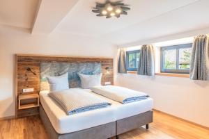 Postel nebo postele na pokoji v ubytování Hotel Alpensonne