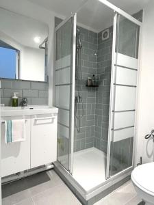 a bathroom with a shower and a sink at 731 Joli studio mezzanine proche du métro L9 in Bagnolet