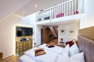a bedroom with two beds and a staircase at Schlosshotel Mondsee in Mondsee +61 photos