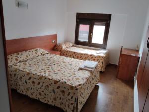 Postel nebo postele na pokoji v ubytování Pension Urola