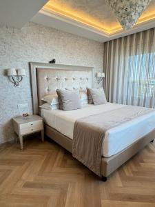 Postel nebo postele na pokoji v ubytování Grand Hotel Gallia