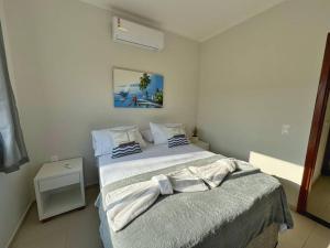 a bedroom with a bed in a room at Canoa Quebrada, CE in Aracati +6 photos