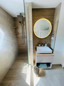 a bathroom with a sink and a mirror at Hausboot direkt auf der Weser in Hameln +9 photos