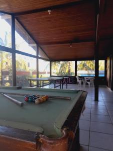a pool table in a pavilion with a pool table at Pousada Flora Búzios in Búzios
