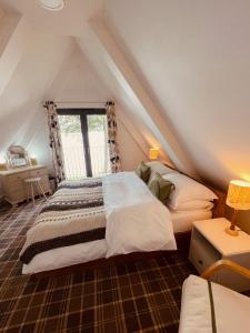 Postel nebo postele na pokoji v ubytování Lochend Chalets
