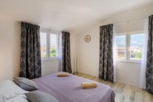 Postel nebo postele na pokoji v ubytování Apartman Dora Metković
