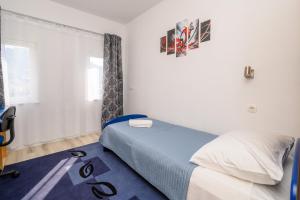 Postel nebo postele na pokoji v ubytování Apartman Dora Metković