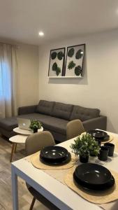a living room with a couch and a table at MRS El mirador de la Alcazaba in Antequera