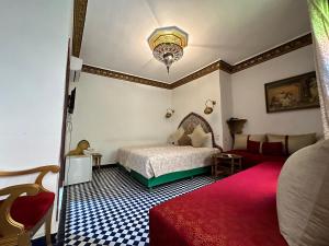 Postel nebo postele na pokoji v ubytování Riad Shama Fes