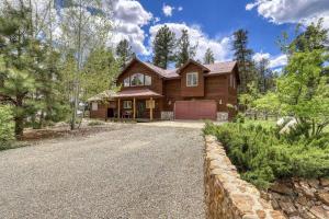 a large wooden house with a driveway at 460 Hills Circle in Nutria