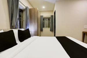 Postel nebo postele na pokoji v ubytování Super Hotel O Luxe Villa