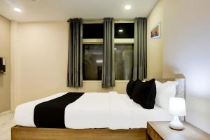 Postel nebo postele na pokoji v ubytování Super Hotel O Luxe Villa