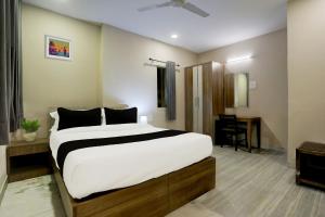 Postel nebo postele na pokoji v ubytování Super Hotel O Luxe Villa