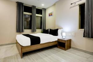 Postel nebo postele na pokoji v ubytování Super Hotel O Luxe Villa