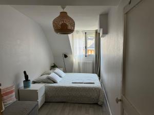 Ένα ή περισσότερα κρεβάτια σε δωμάτιο στο Appartement central - ORLEANS