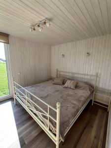 Postel nebo postele na pokoji v ubytování Mežmalas atpūtas bāze