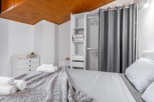 Rúm í herbergi á Gallarate Central Suite