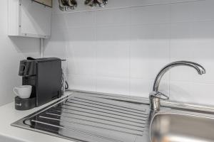 Eldhús eða eldhúskrókur á Gallarate Central Suite