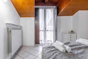Rúm í herbergi á Gallarate Central Suite