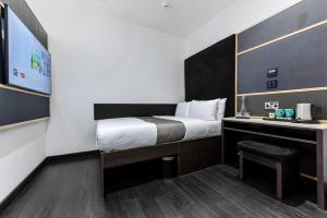 Postel nebo postele na pokoji v ubytování The Z Hotel Strand