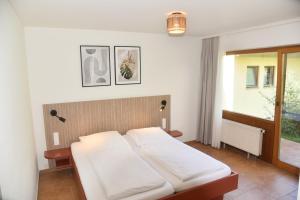 Postel nebo postele na pokoji v ubytování Wohlfühlhotel Sonnengarten