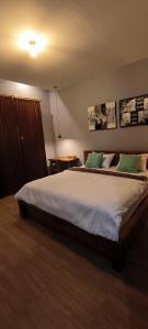 Postel nebo postele na pokoji v ubytování Tanggu ubud homestay