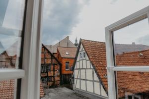 a view from a window of buildings at sleepArt cream in Celle