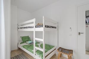 a bedroom with two bunk beds in a room at Tulum Airostel in San Isidro