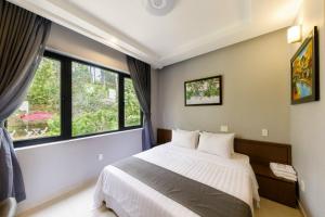 Letto o letti in una camera di Biệt Thự Khởi Nghĩa Bắc Sơn TP Đà Lạt - Gần Chợ và Hồ Xuân Hương