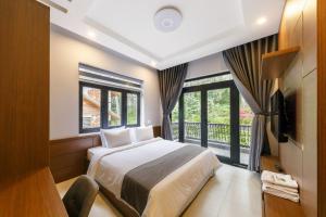 Letto o letti in una camera di Biệt Thự Khởi Nghĩa Bắc Sơn TP Đà Lạt - Gần Chợ và Hồ Xuân Hương