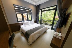 Letto o letti in una camera di Biệt Thự Khởi Nghĩa Bắc Sơn TP Đà Lạt - Gần Chợ và Hồ Xuân Hương