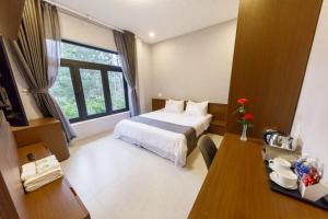 Letto o letti in una camera di Biệt Thự Khởi Nghĩa Bắc Sơn TP Đà Lạt - Gần Chợ và Hồ Xuân Hương