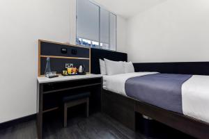 Postel nebo postele na pokoji v ubytování The Z Hotel Strand