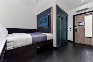 Postel nebo postele na pokoji v ubytování The Z Hotel Strand