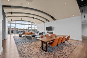 a dining room with a table and chairs at 1700 Bassett, Unit 818 in Denver