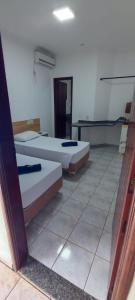 Rúm í herbergi á Hotel Marambaia Ponta Porã
