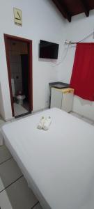 Rúm í herbergi á Hotel Marambaia Ponta Porã